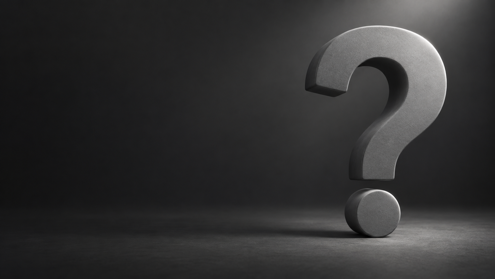 Grey question mark softly lit against a charcoal background